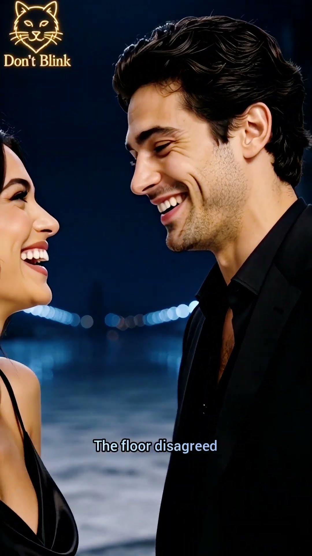 A woman and a man laughing hard at night above a wet street, city lights blurred behind them.