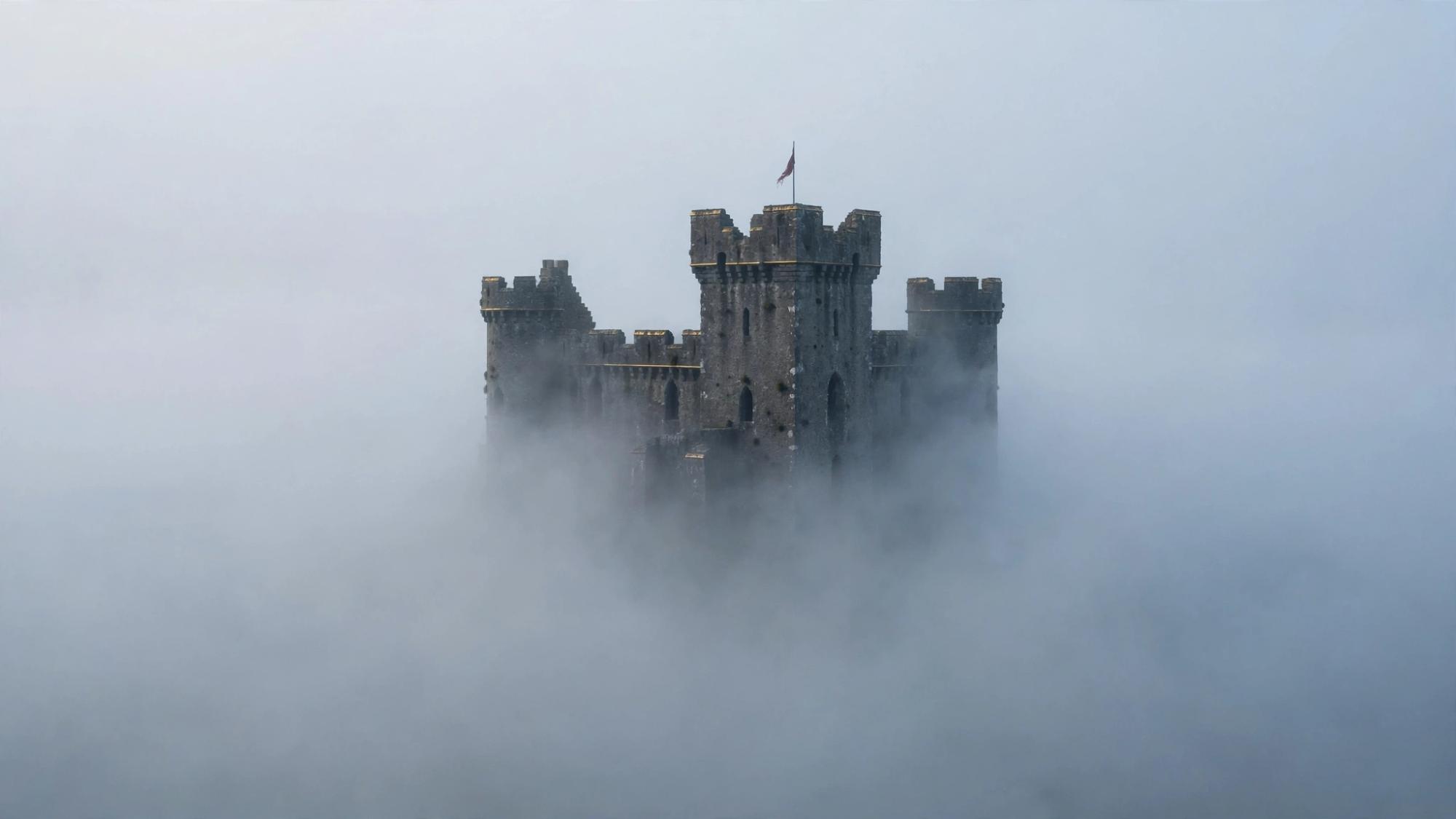A castle in fog with no edge. Morning stays outside. No path.